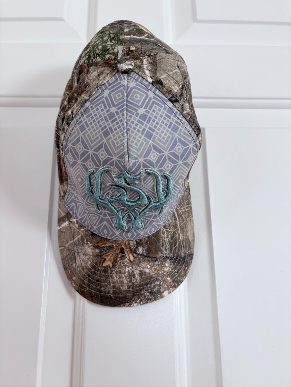 Lady’s Fit Camouflage Baseball Cap with Teal Embroidered Logo